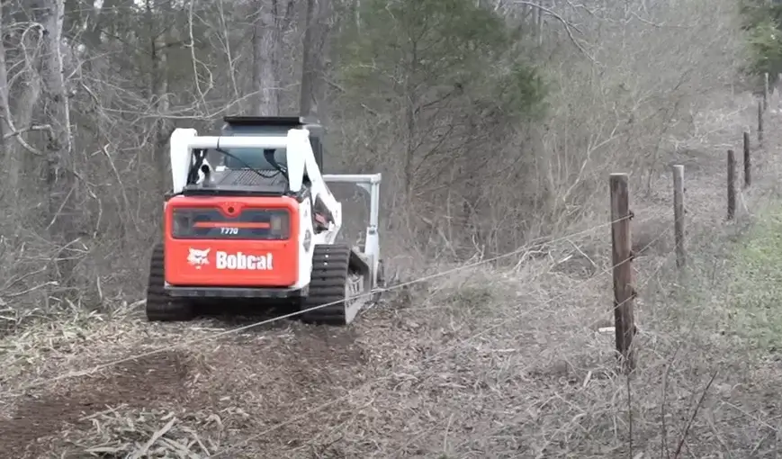 bobcat-skidsteer-hydro-axing-right-of-way-for-new-gas-line-trench