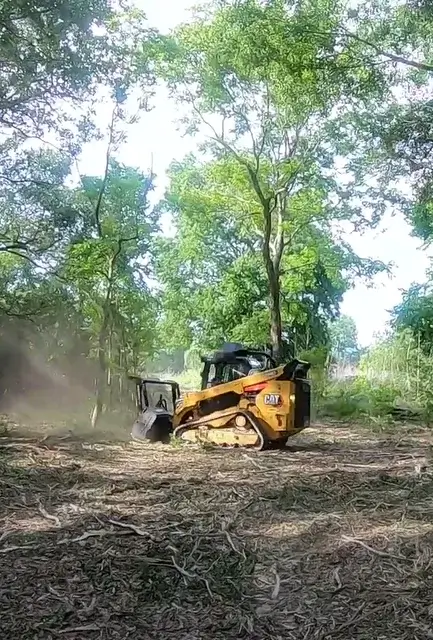 hydro-ax-cutting-system-mounted-on-CAT-skid-steer